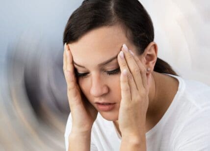 Woman Suffering From Headache Dizziness